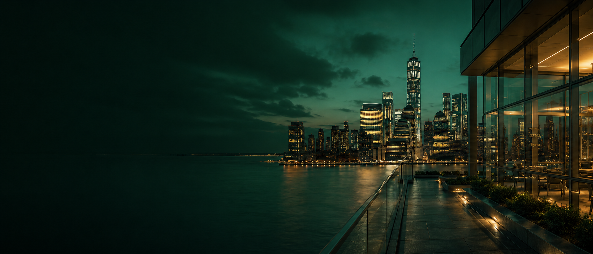 City skyline at dusk viewed from a glass terrace